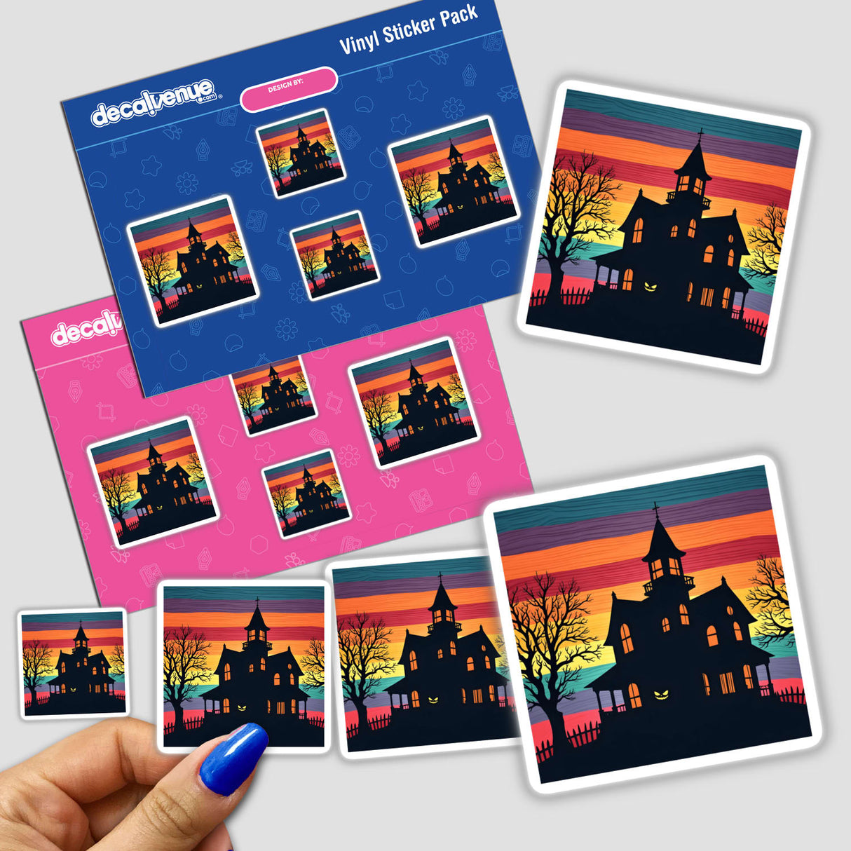 Hand holding a sticker pack featuring a Haunted House Silhouette with Vibrant Stripes, depicting a house with trees against a colorful background.