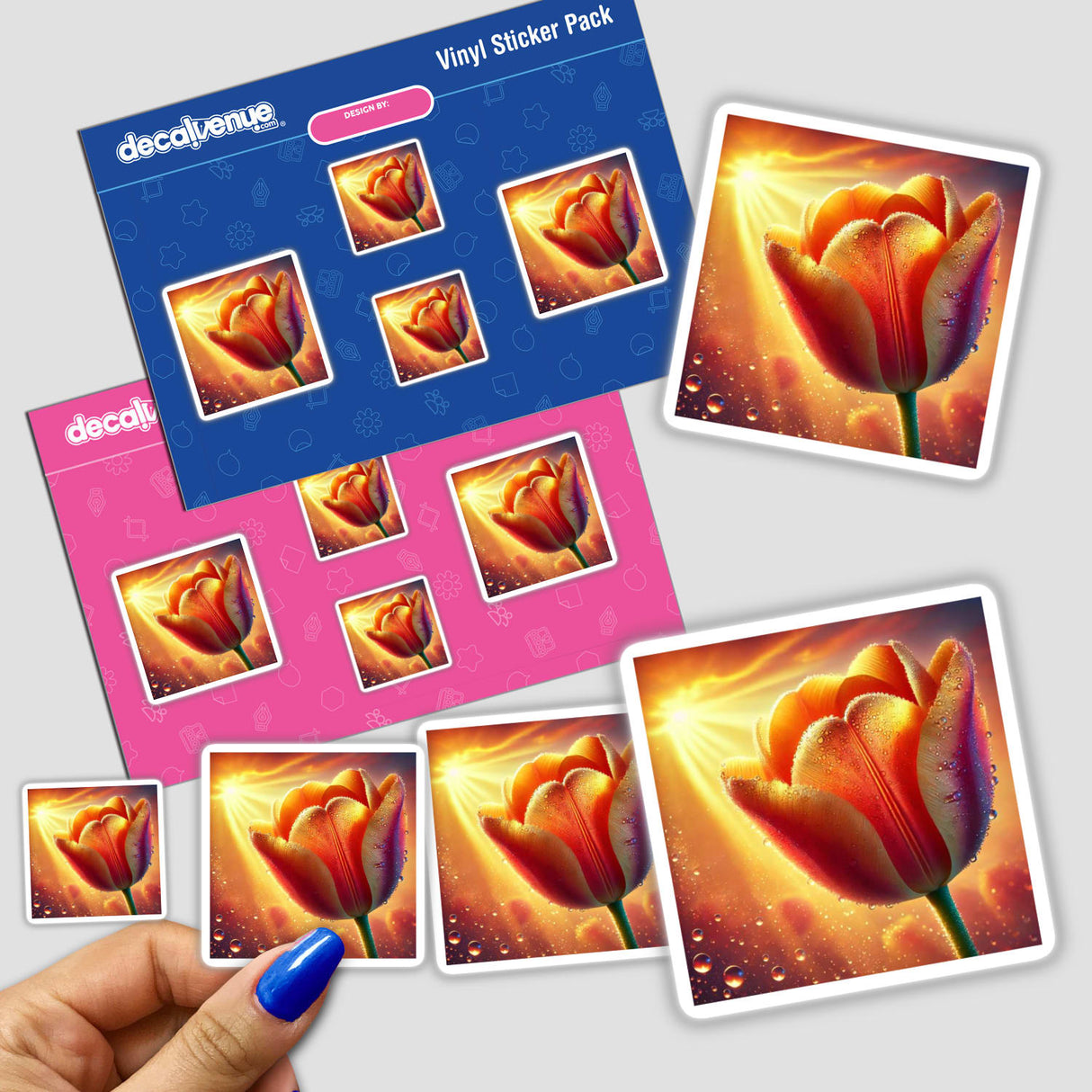 Hand holding a Tangerine Tulip with Dewy Glow sticker pack, featuring detailed floral designs.