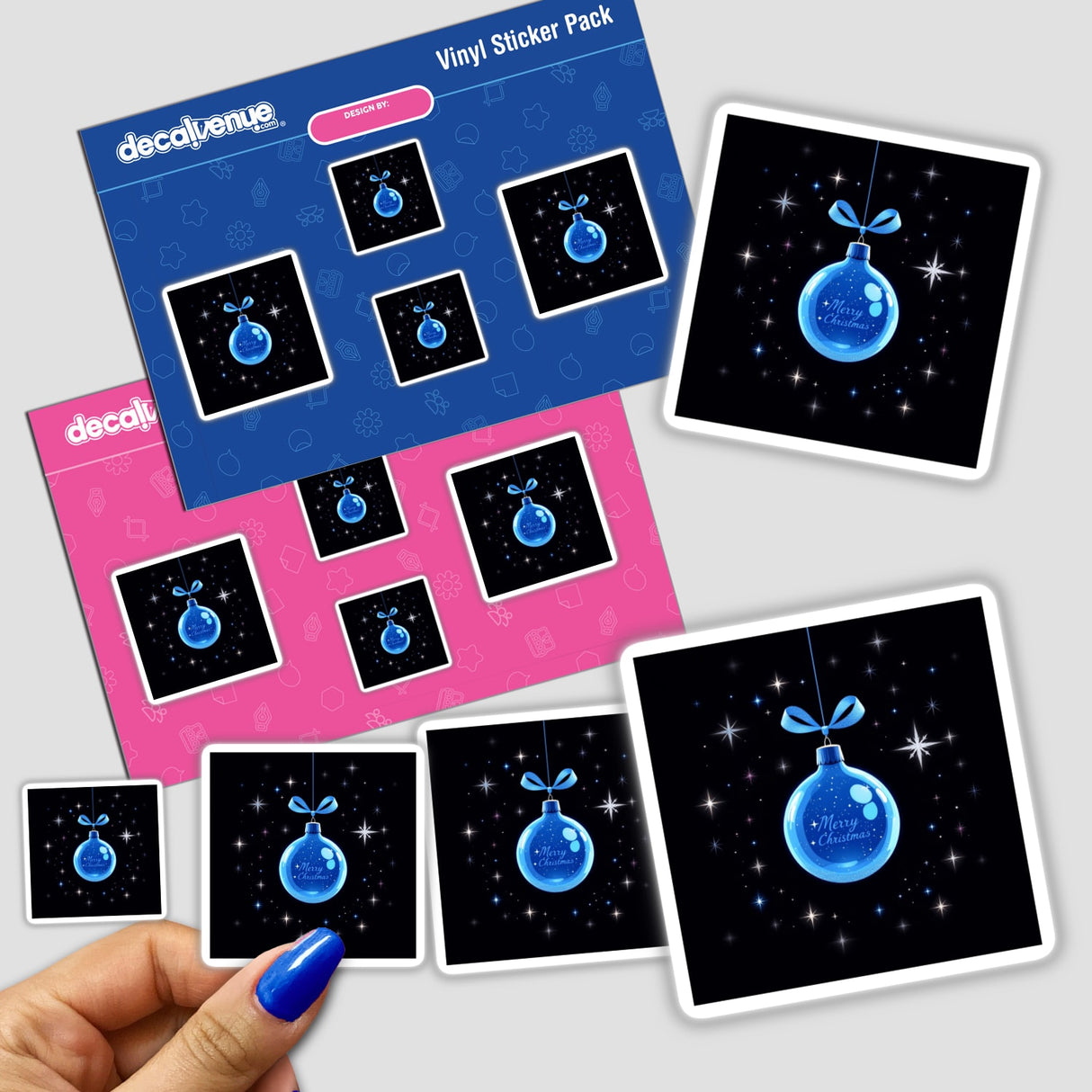 Blue Ornament with Silver Ribbon and Glitter Stars sticker pack held by a hand, showcasing intricate festive design elements ideal for decorating or digital art use from Decal Venue.
