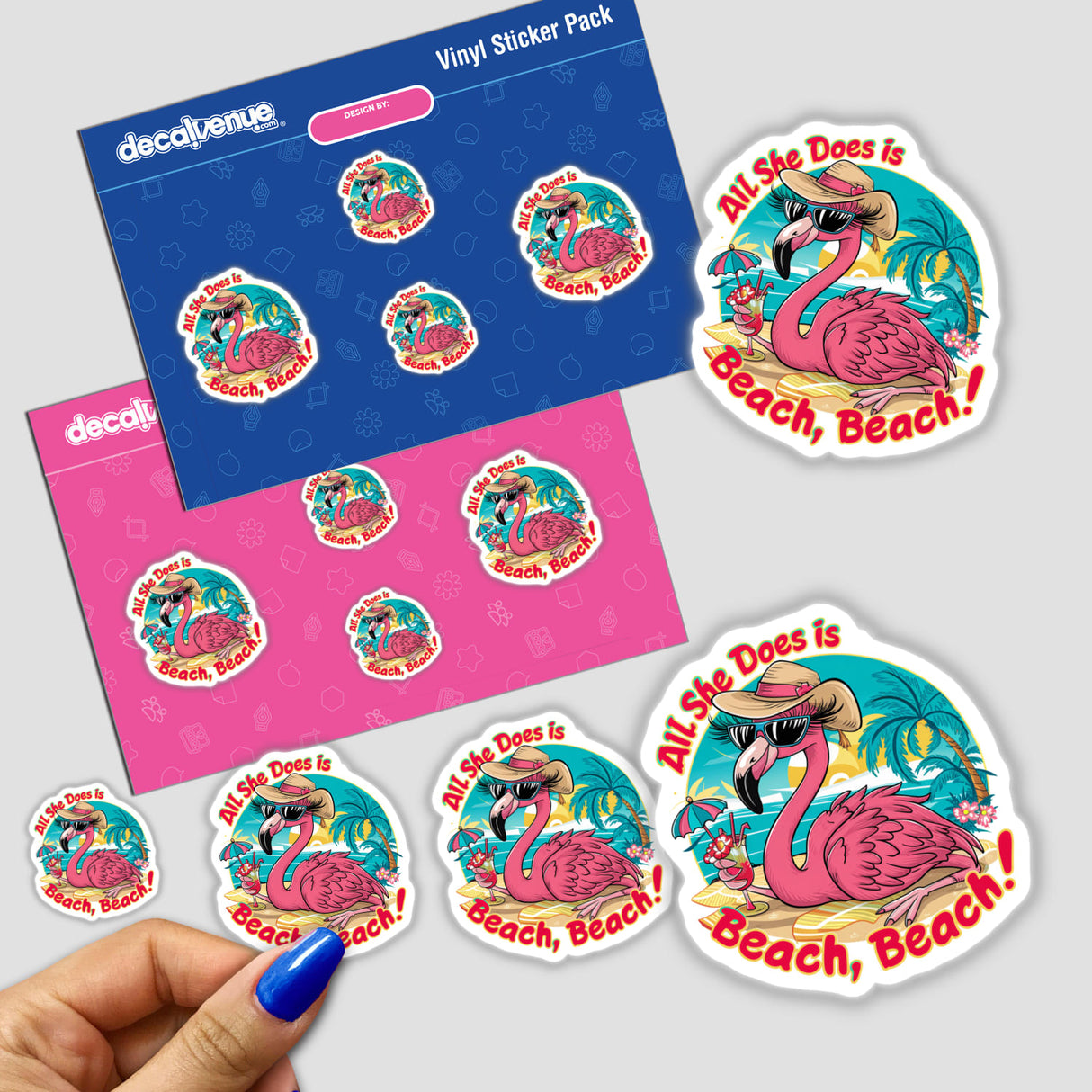 Vibrant flamingo-themed digital artwork stickers on a blue and pink background. The stickers feature a flamingo bird surrounded by beach motifs like ocean waves and tropical flowers, along with the text "All She Does is Beach, Beach". This product from the Decal Venue store showcases the creative, colorful designs by the brand Ella Designz.