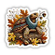 Autumn Turtle in Cozy Turtleneck - Digital artwork featuring a turtle wearing a patterned turtleneck nestled among autumn leaves, acorns, and other natural elements.