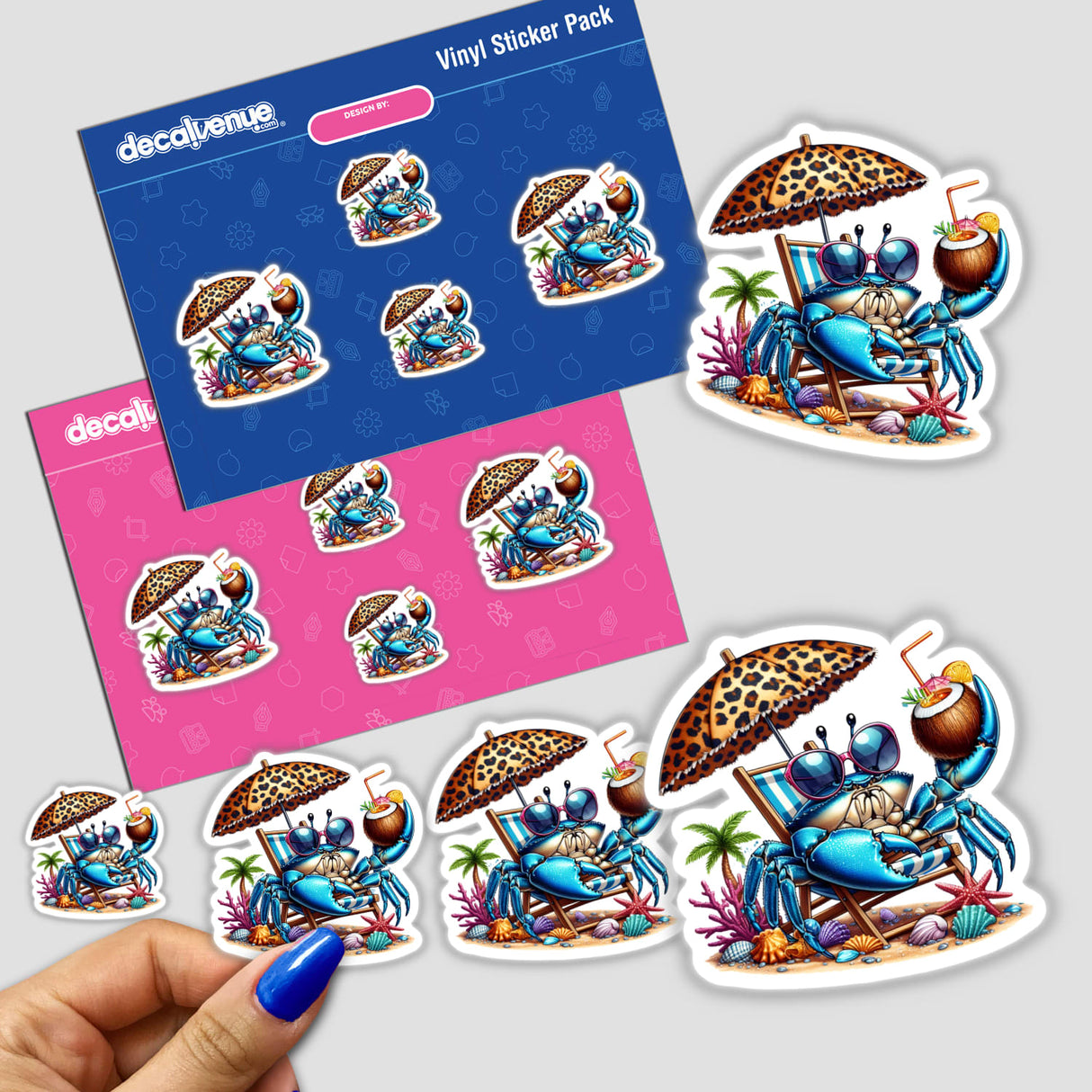 Summertime Blue Crab with Coconut Drink sticker pack, featuring blue cartoon crabs on beach chairs under umbrellas. A hand displays one sticker, with various sizes shown, highlighting Decal Venue's unique vinyl offerings.