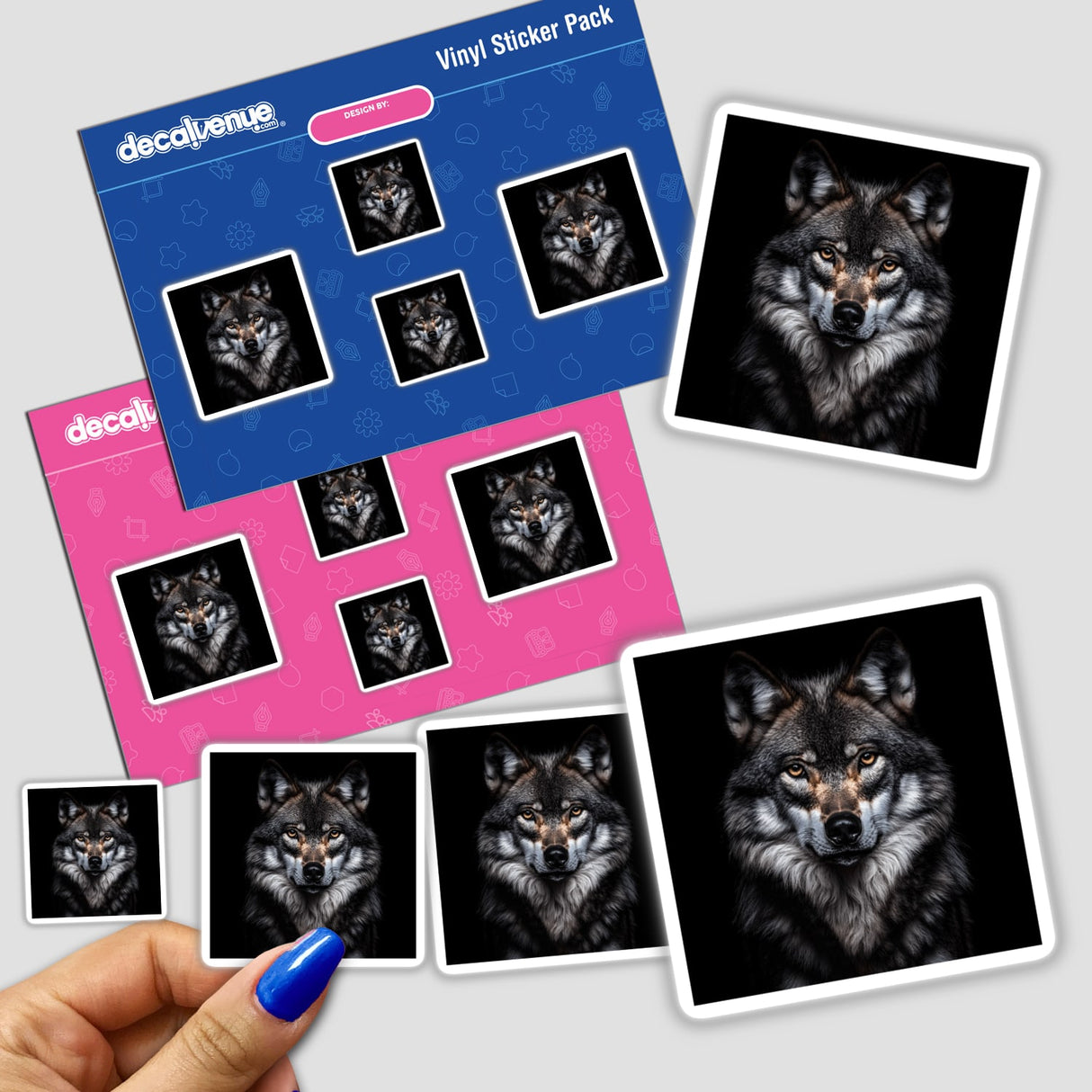 Hand holding a sticker pack featuring a Cinematic Wolf Portrait on Black Background, showcasing detailed wolf faces.