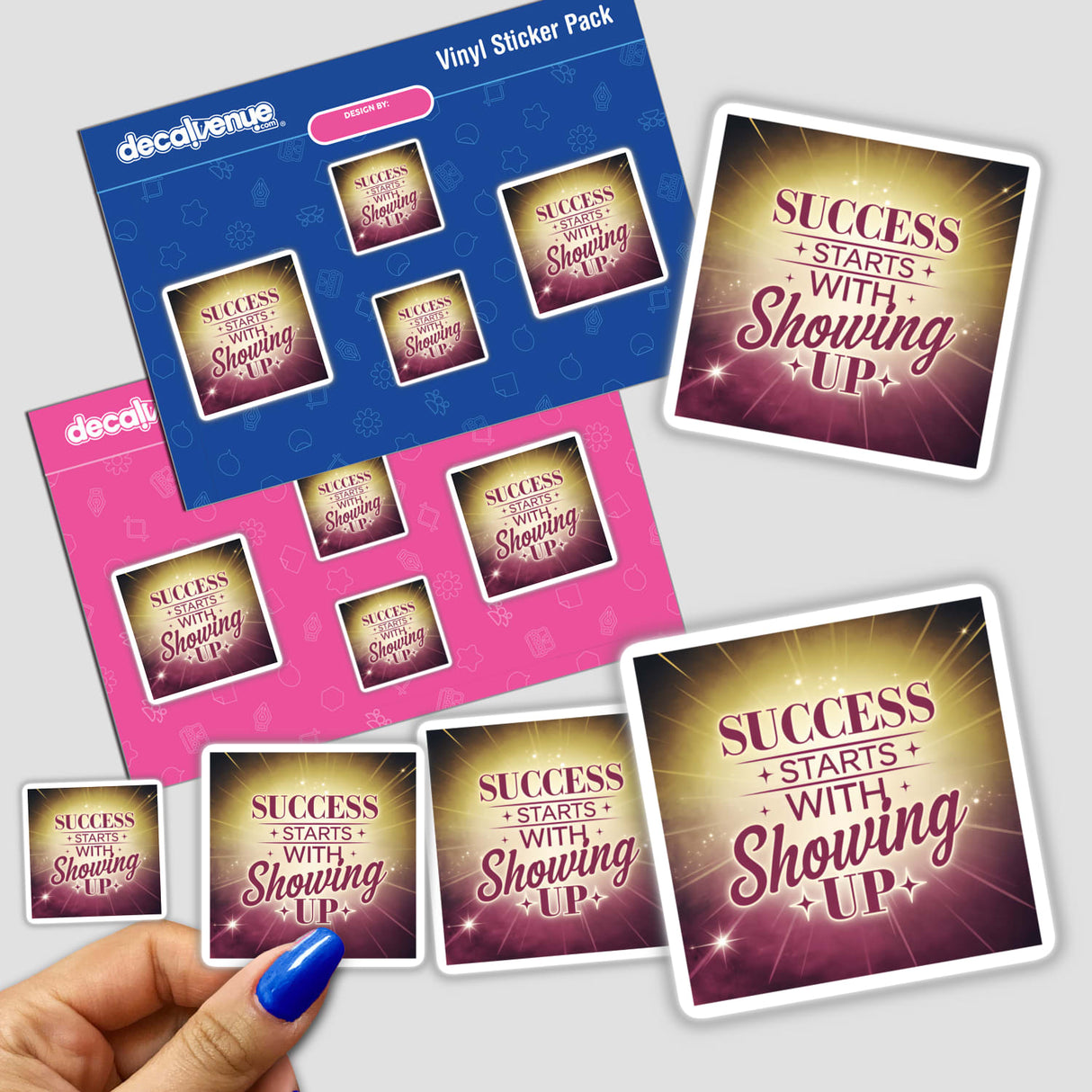 Hand holding a sticker pack titled SUCCESS STARTS WITH SHOWING UP, showcasing Decal Venue's unique vinyl stickers and digital art.