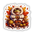 Autumn Frog in Cozy Sweater: A cartoon frog wearing a white coat and holding a basket of fruits, available as stickers or digital artwork.