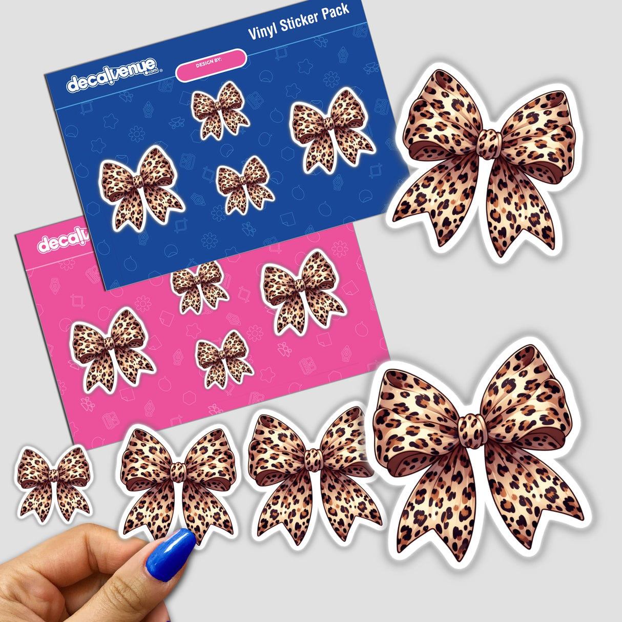 Leopard Print Coquette Bow sticker pack held in hand, showcasing varied leopard print designs, available as unique vinyl stickers or digital artwork from Decal Venue.