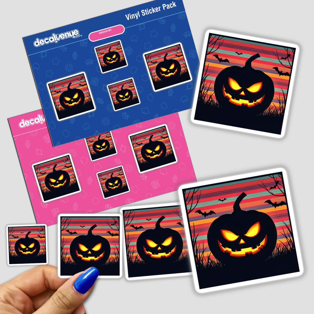 Hand holds a Pumpkin Silhouette with Bold Color Stripes Halloween sticker featuring a black pumpkin with bats, perfect for unique Halloween décor.