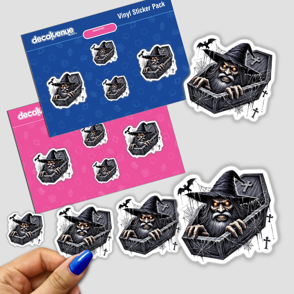 Wizard Peeking Out of Coffin Halloween - Digital artwork featuring a spooky wizard peeking out from a coffin, on a blue and pink vinyl sticker pack from Decal Venue, an online store specializing in custom stickers and digital art.