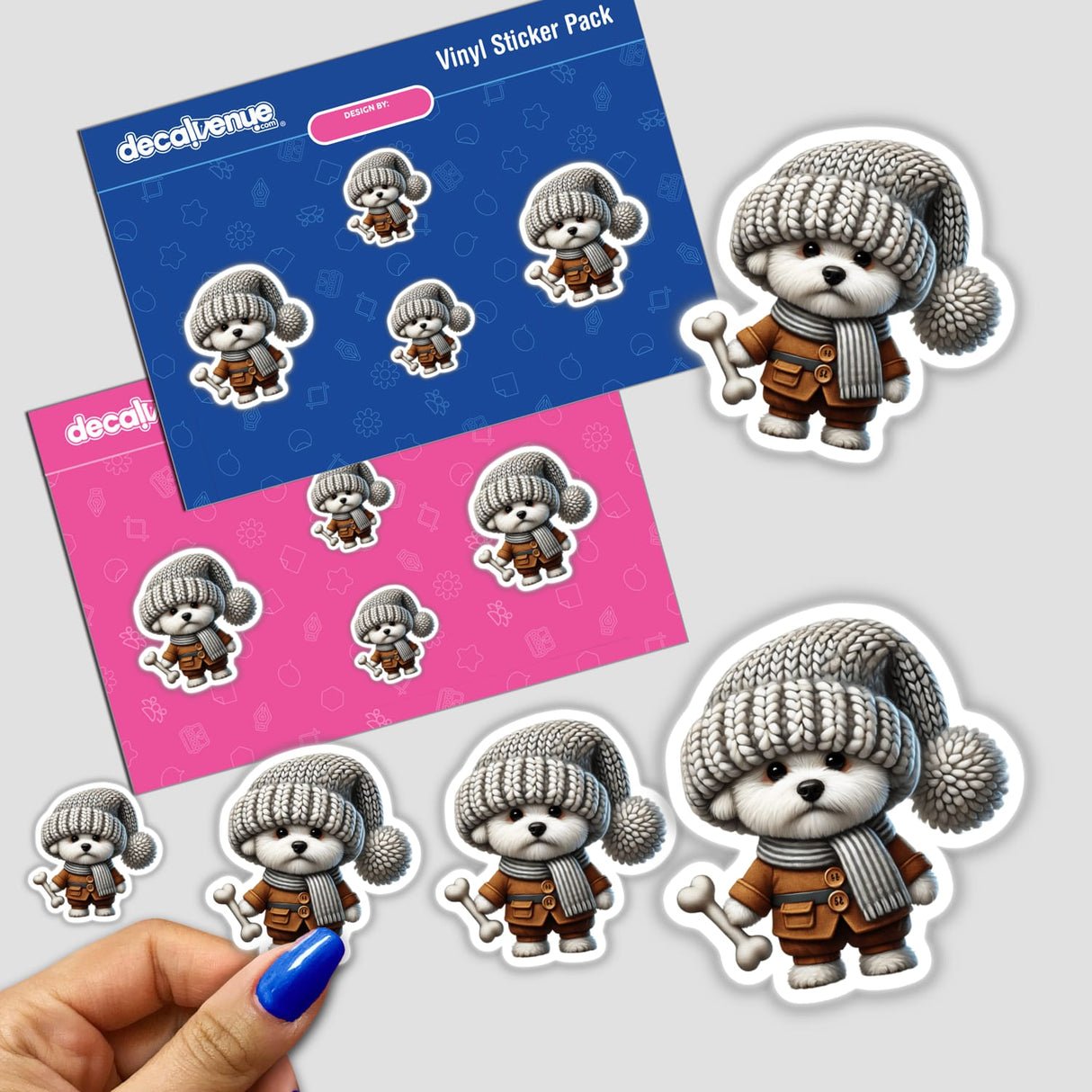 Adorable Bichon Frise gnome stickers holding a dog bone, displayed on a colorful Decal Venue vinyl sticker pack.