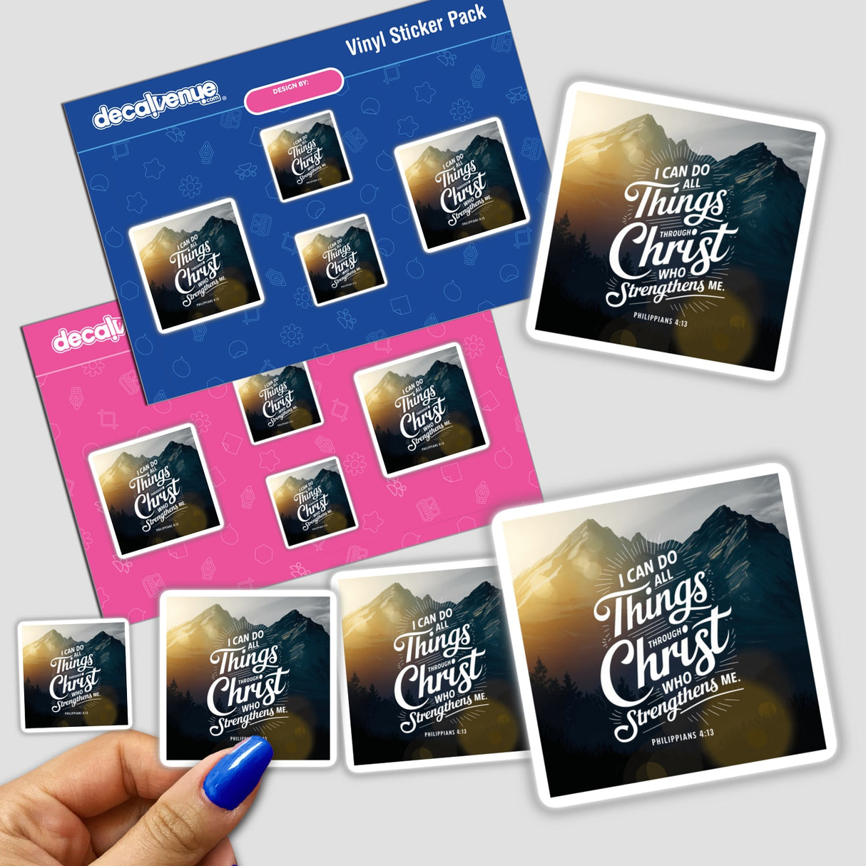 Hand holding a sticker pack titled Philippians 4:13 I can do all things through Christ who strengthens me, featuring mountain images, reflecting Decal Venue's unique vinyl stickers and digital art offerings.