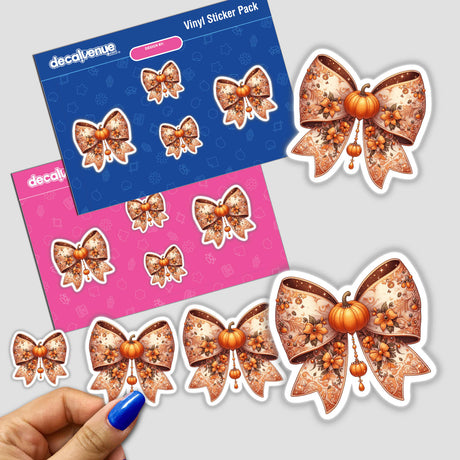 Orange Pumpkin Intricate Coquette Bow sticker pack featuring bows adorned with pumpkins and flowers. Close-up of a hand holding a sticker. Available as stickers or digital artwork from Decal Venue.