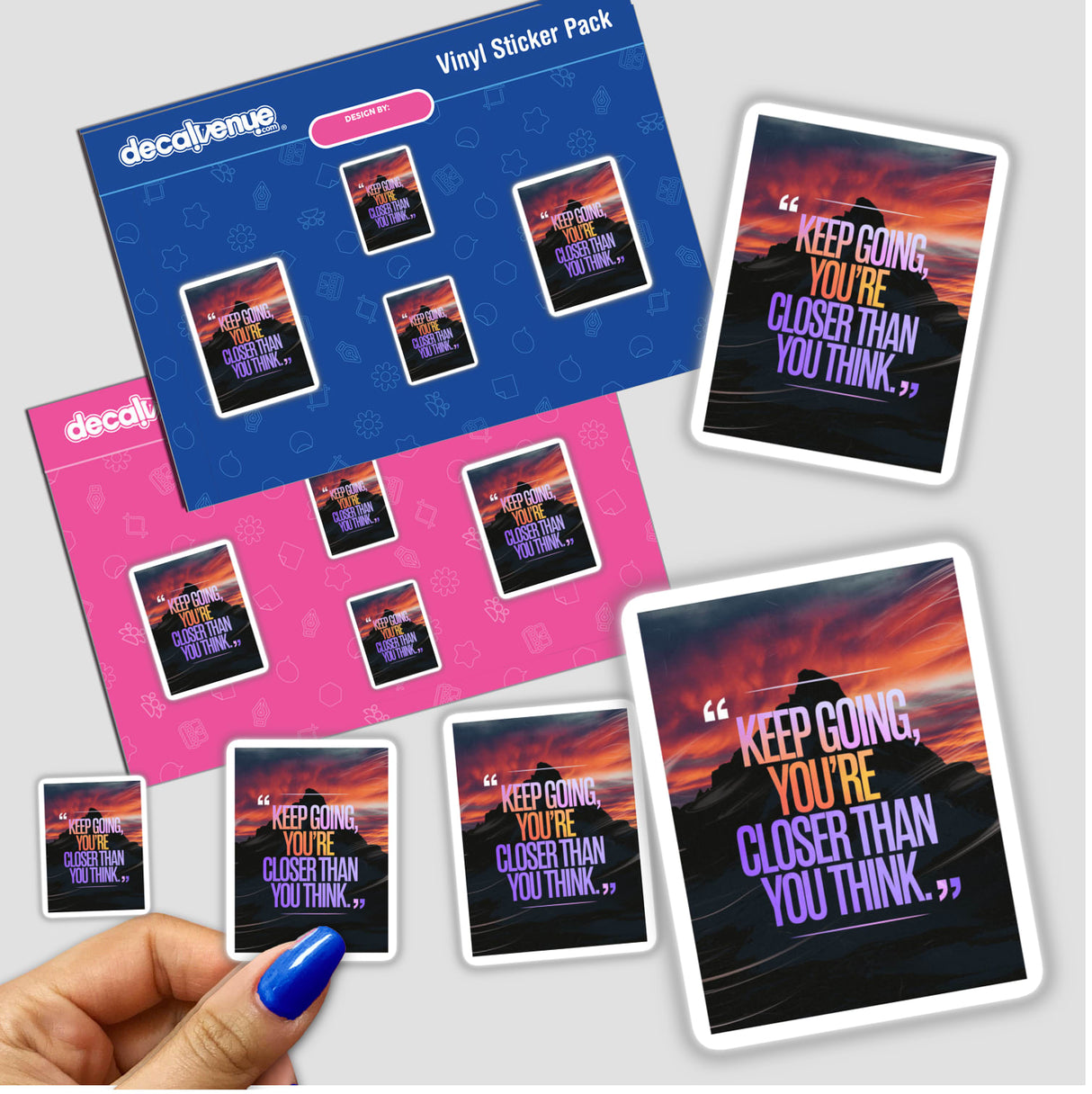 Hand holding a sticker pack titled Keep going, you’re closer than you think, showcasing unique vinyl designs, capturing the essence of motivational art from Decal Venue.