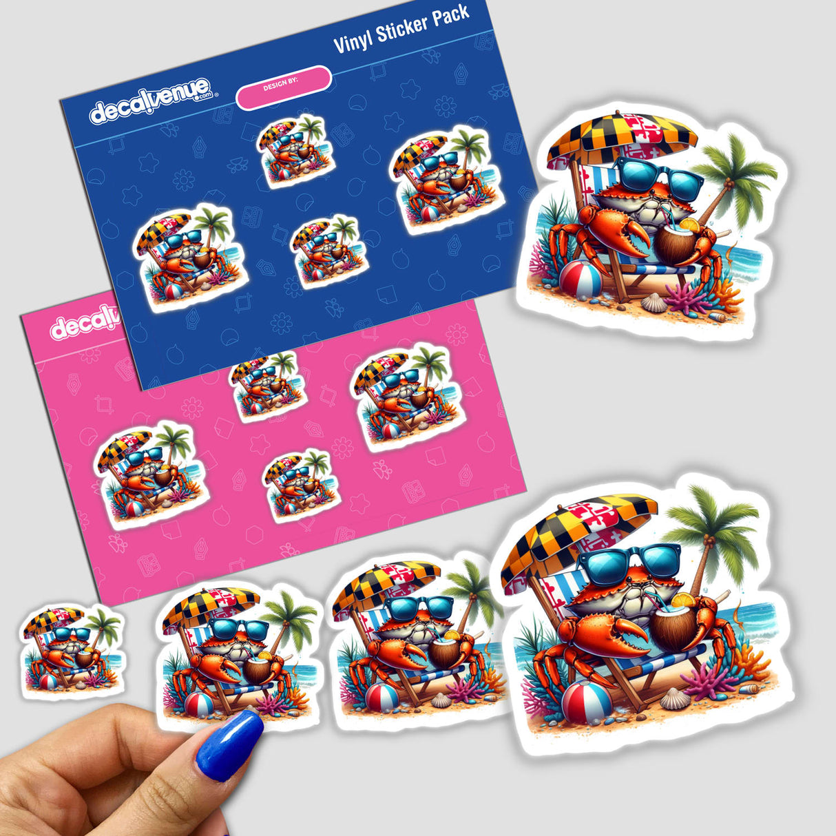 Vinyl sticker pack Tropical Blue Crab on Beach Sipping Coconut Drink II from Decal Venue, featuring cartoon crabs with Maryland flag umbrellas. A hand peels a sticker; loose stickers vary in size.