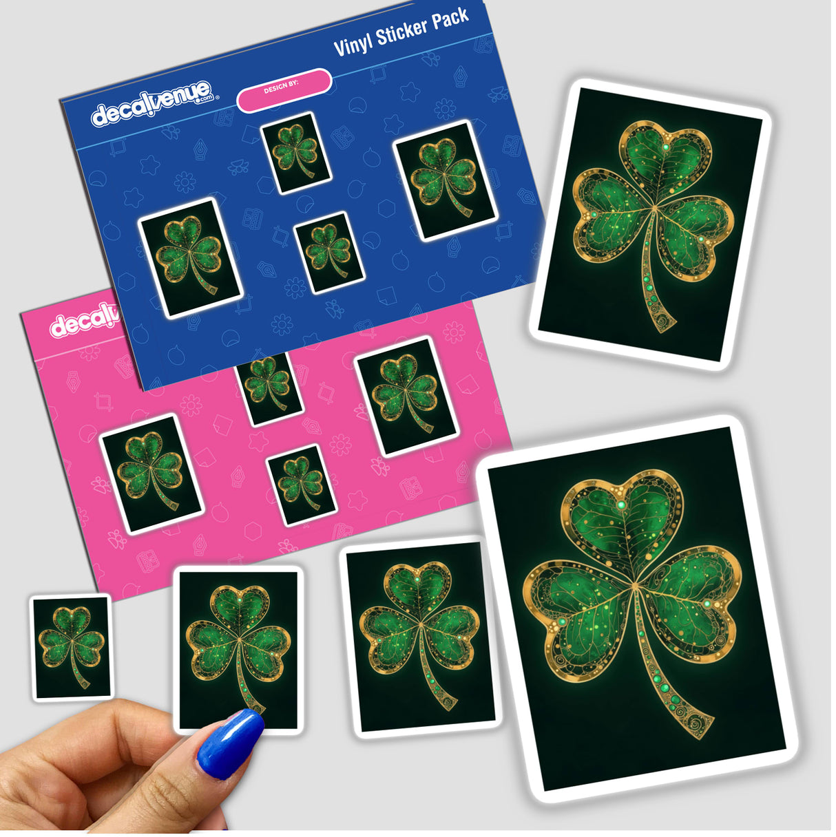 Shamrock – Green Clover with Gold and Emerald Accents sticker, featuring a detailed shamrock design. A hand and card nearby suggest its use as a decorative element or digital artwork.