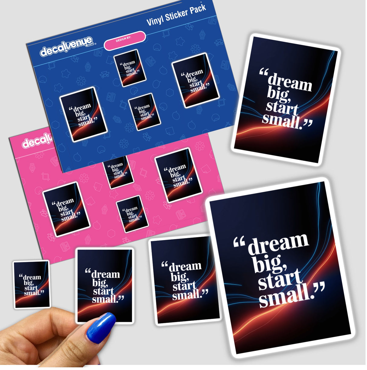 Hand holding a Dream big, start small sticker pack from Decal Venue, showcasing unique vinyl stickers and digital artwork options, embodying motivational design elements.