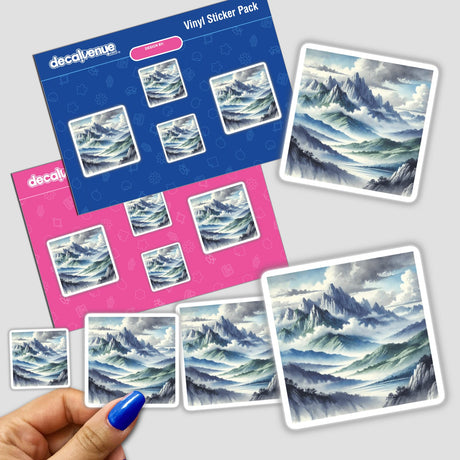 Hand holding Mountain Majesty - Watercolor Peaks and Valleys stickers, showcasing painted mountains and clouds in the background.