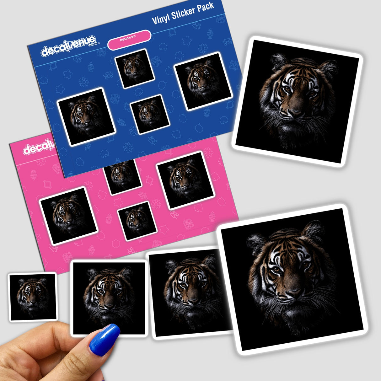 Hand holding the Cinematic Tiger Portrait on Black Background sticker pack, featuring detailed tiger faces.