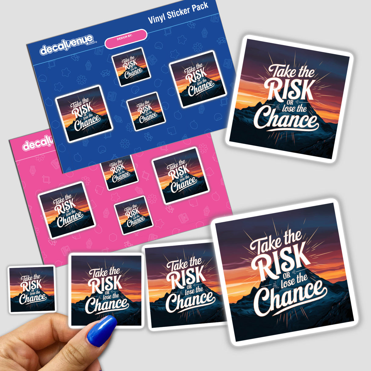 Hand displaying a Take the risk or lose the chance sticker pack, with graphic designs featuring text and mountainous backgrounds, associated with Decal Venue's unique vinyl sticker collection.