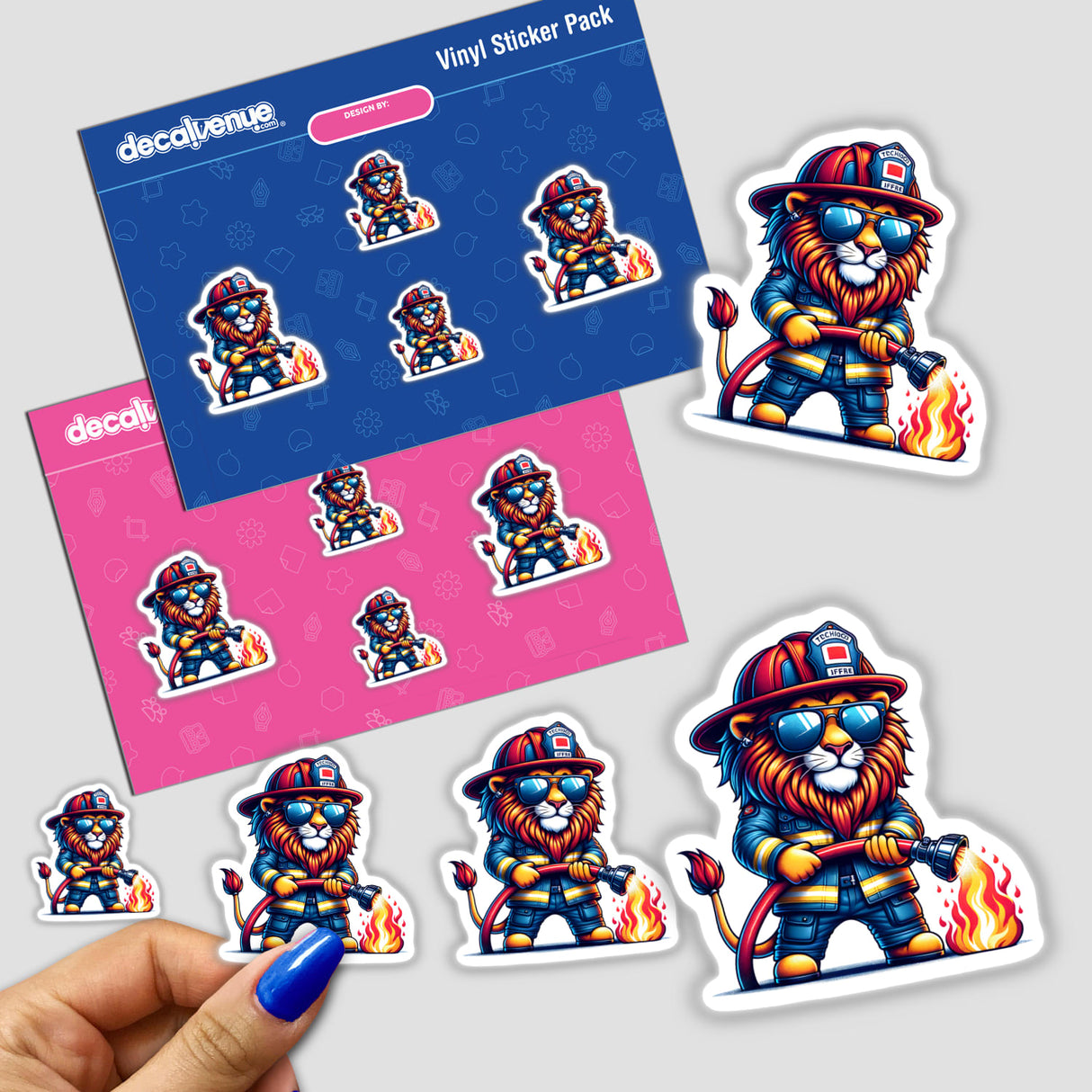 Vibrant stickers featuring a cartoon lion firefighter putting out a fire, surrounded by additional matching stickers. The stickers are presented on a Decal Venue branded packaging, showcasing the product's design and branding.