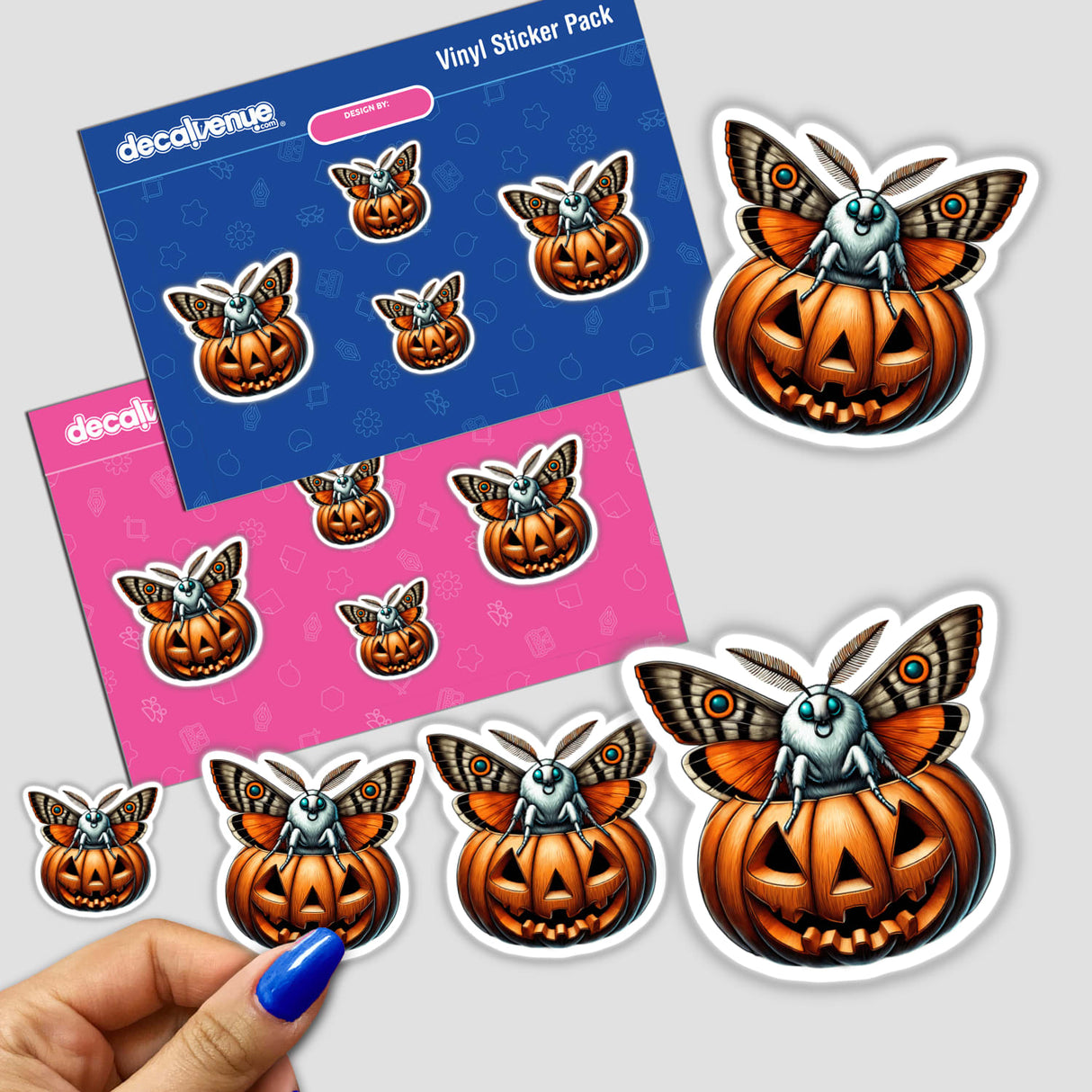 Artistic Halloween-themed digital stickers featuring a moth peeking out of a carved pumpkin, displayed on colorful packaging from the Decal Venue brand.