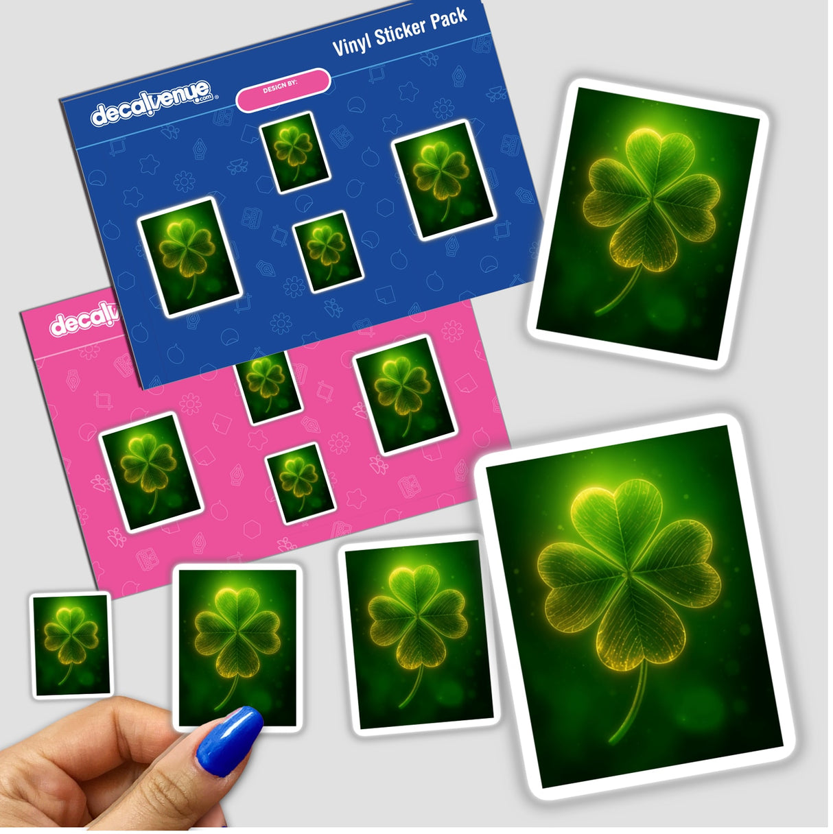 Glowing Four-Leaf Clover sticker pack, featuring radiant green shamrocks with golden highlights, held in hand. Ideal from Decal Venue's unique vinyl sticker and digital art collection.