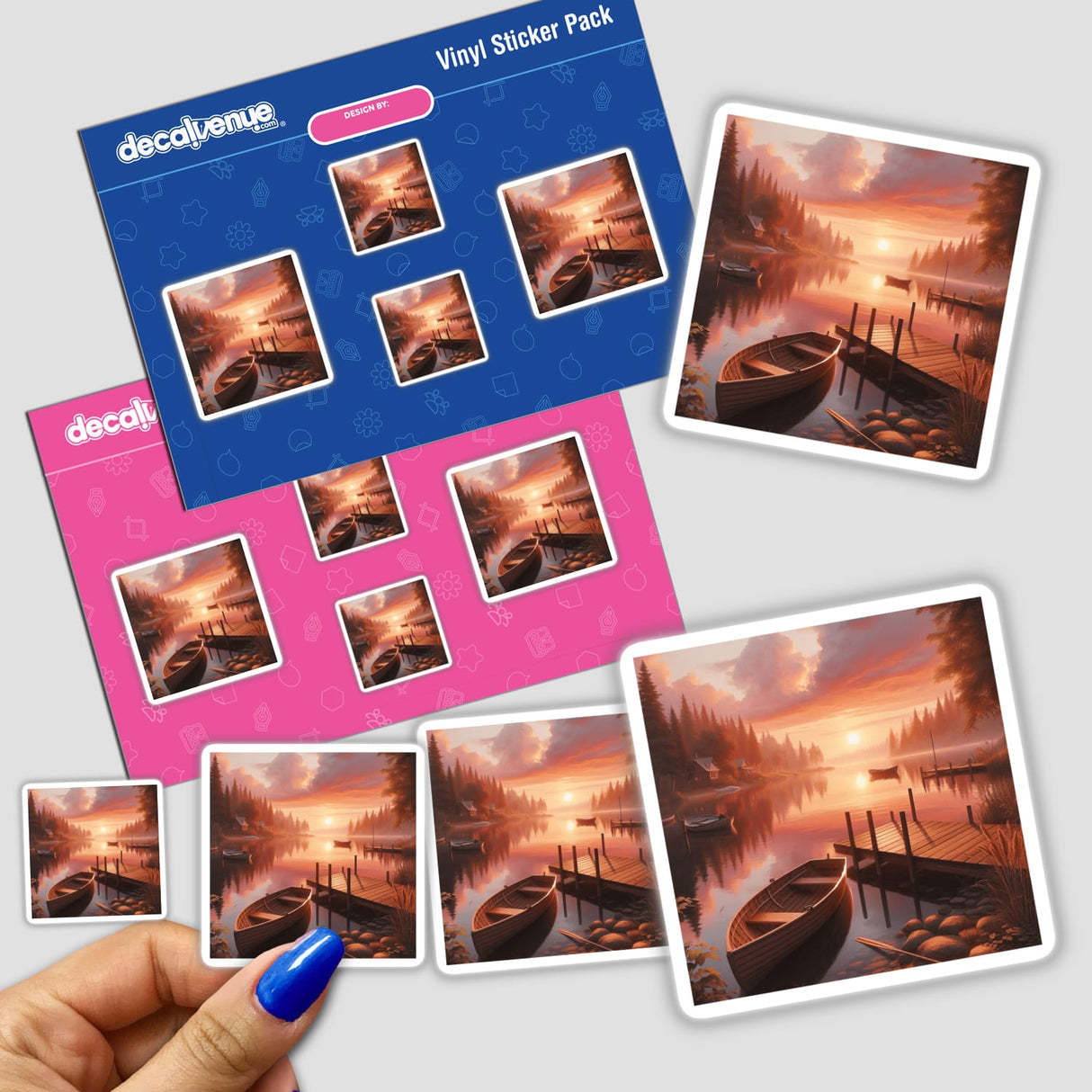 Sticker pack depicting a serene lake scene with boats and a dock during sunset, held in hand. Available as vinyl stickers or digital artwork, reflecting Decal Venue's unique artistic offerings.