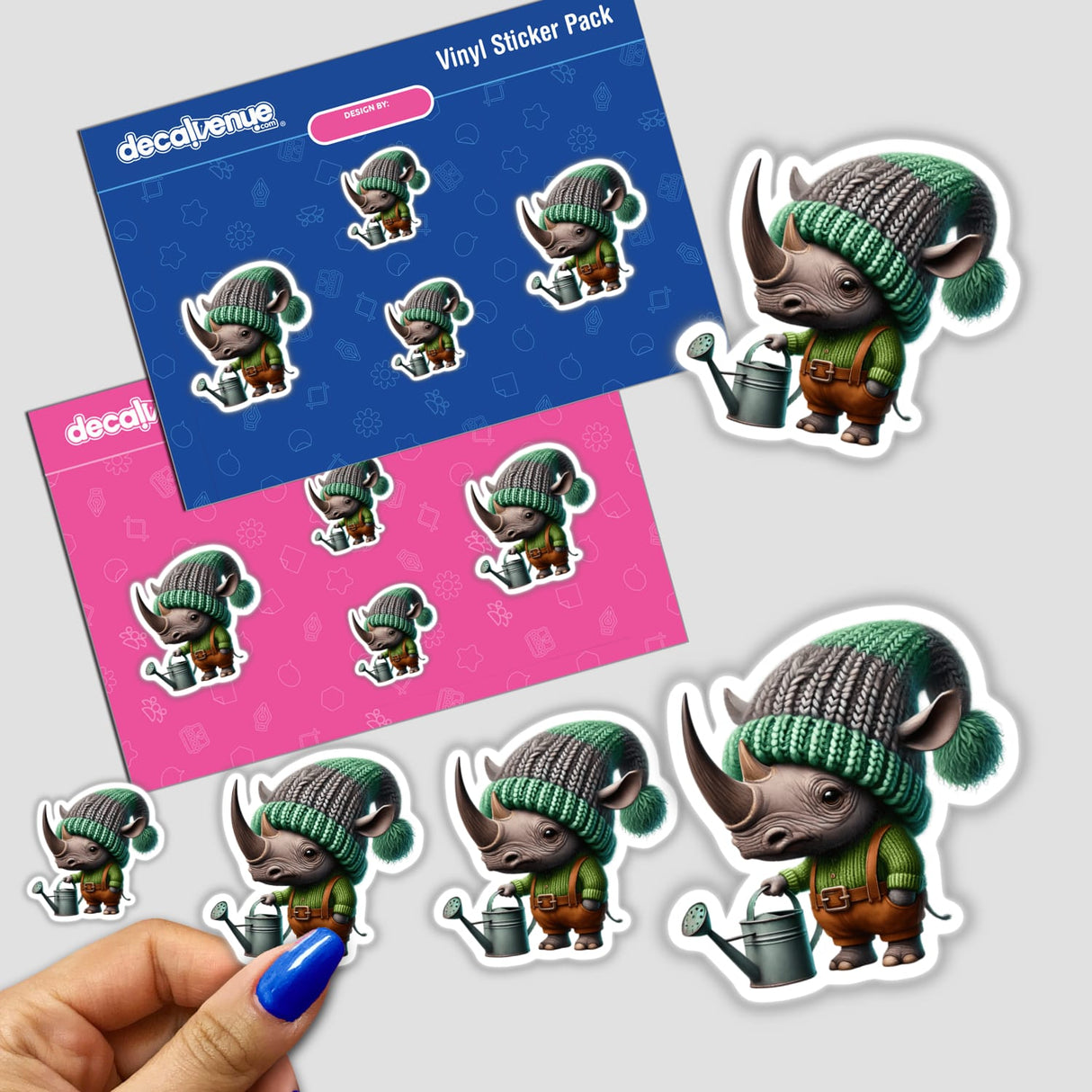 Person holding a sticker featuring a cartoon rhinoceros with a watering can from Decal Venue's unique collection, available as stickers or digital artwork.