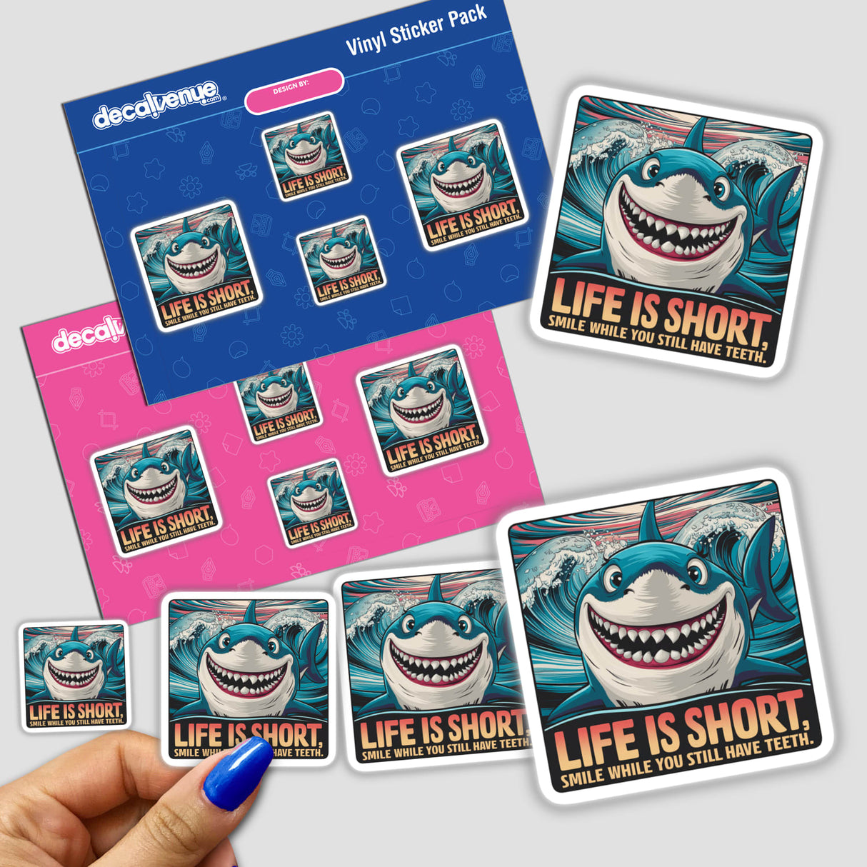 Vibrant digital artwork stickers depicting a smiling shark with the message "Life is short. Smile while you still have teeth" on a Decal Venue product packaging.