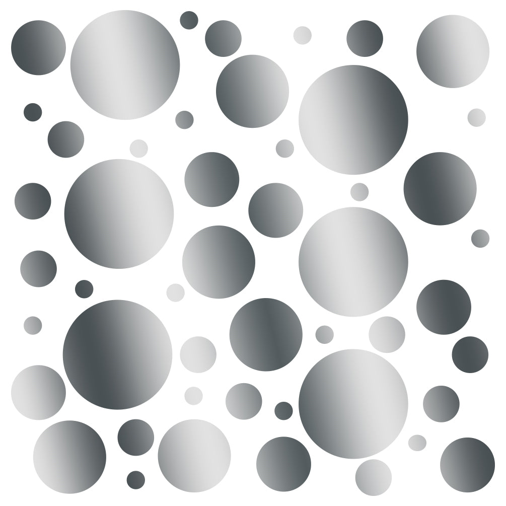 Assorted grayscale polka dot circles of various sizes in a scattered arrangement on a transparent background.