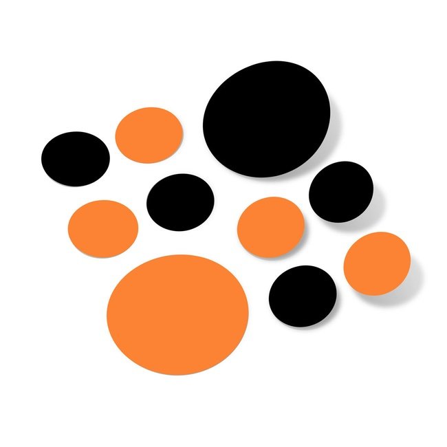 Black and orange polka dot circles wall decals assortment on white background.