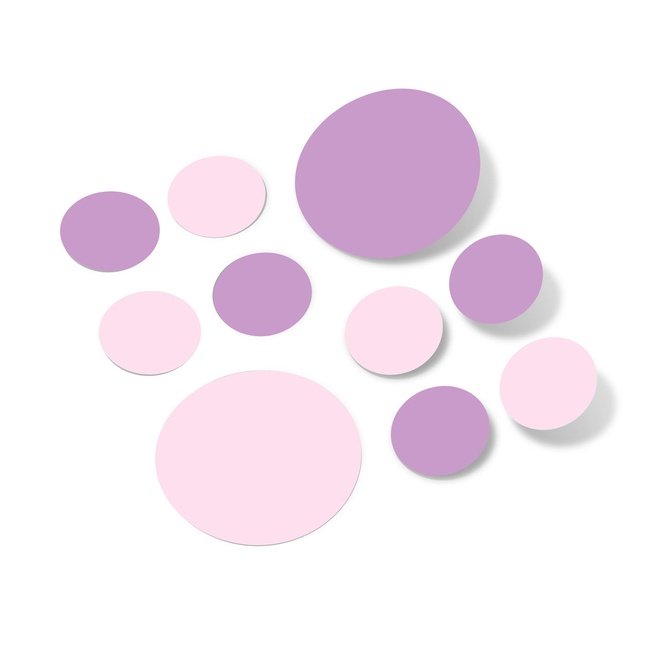 Baby pink and lilac polka dot circle wall decals on a white background.