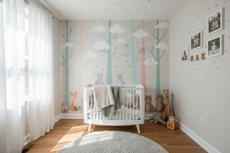 DIY wall decor ideas for a nursery featuring playful animal decals and personalized photo gallery
