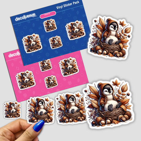 Autumn Penguin in Cozy Sweater sticker pack featuring cartoon penguins in nests with leaves and acorns, held in a hand. Available as Stickers or Digital Artwork.