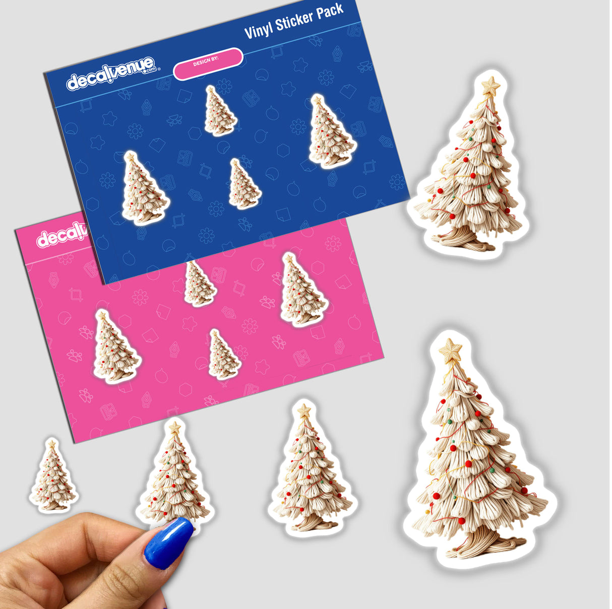 Hand holding a Yarn Christmas Tree sticker pack, showcasing intricate rope-like tree designs, available as unique stickers or digital artwork from Decal Venue.