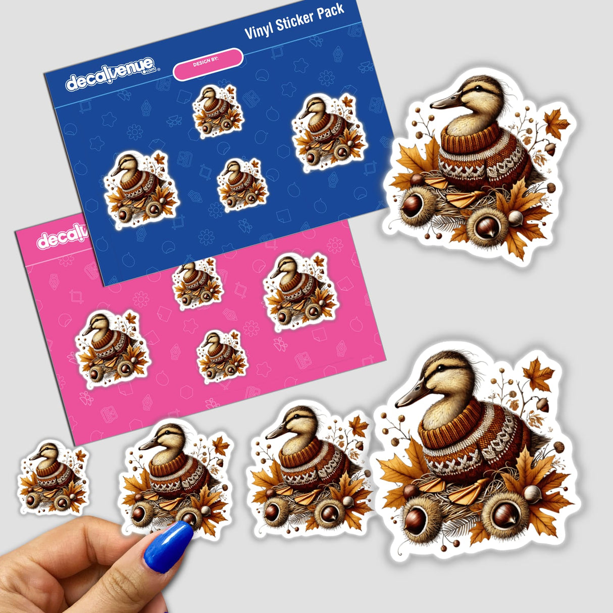 Autumn Duck in Cozy Sweater sticker featuring a cartoon duck wearing a sweater surrounded by leaves and nuts, available at Decal Venue.