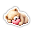 Baby Bear Sleeping on a Heart: A teddy bear cuddles a heart, depicted in charming digital art, perfect as stickers or decor, embodying warmth and whimsy from Decal Venue's unique collection.