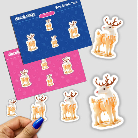 Reindeer Dripping Candle Wax sticker pack, featuring cartoon illustrations of reindeer with melted cream effects. A hand holds the pack, showcasing Decal Venue's unique sticker and digital art offerings.