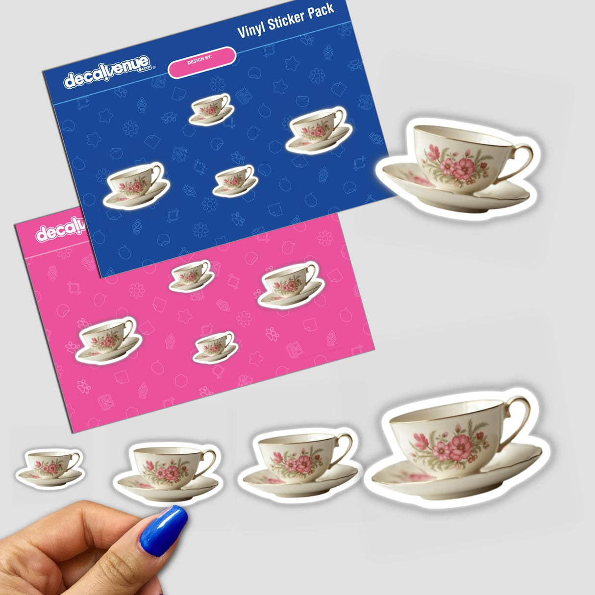 Hand holding a sticker pack featuring various vintage cottagecore teacup designs available as stickers or digital downloads.