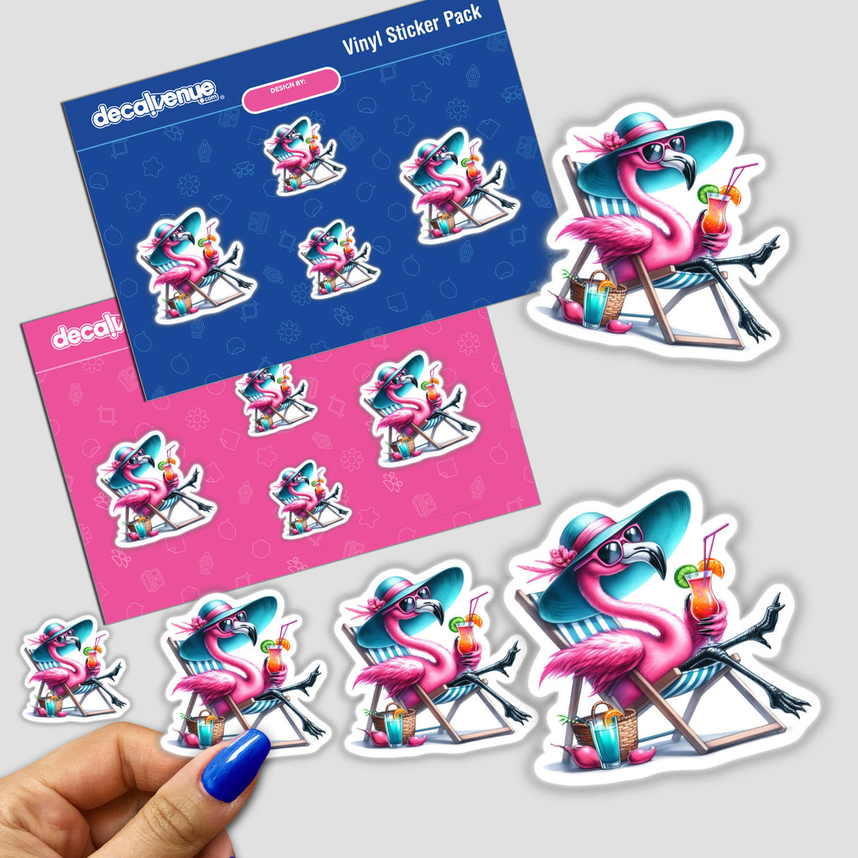 Vibrant vinyl stickers featuring adorable pink flamingo characters in beach-themed poses and accessories, including a flamingo lounging in a beach chair holding a drink. The image showcases the variety of sticker designs available in this colorful product pack.