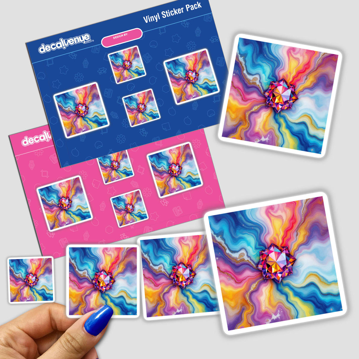 Gemstone Alcohol Ink Design stickers featuring vibrant, artistic diamond patterns. A close-up shows a person's fingers with blue nail polish holding the stickers, emphasizing their intricate detail.