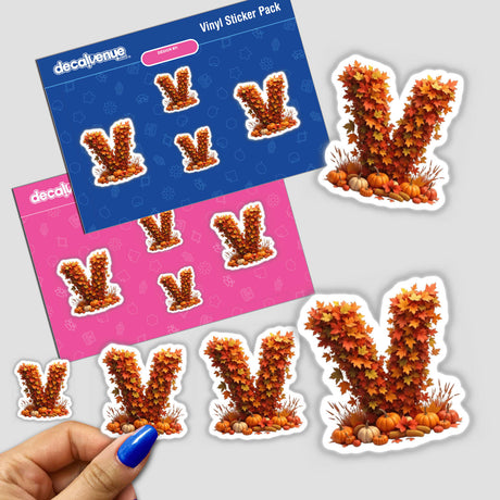 Thanksgiving Letter V Clipart - Fall Leaves and Pumpkins Design - Stickers or Commercial Use Download featuring a hand holding a sticker with orange leaves and pumpkins in the shape of the letter V.
