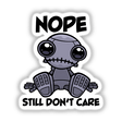 Nope Still Don't Care Cute Indifferent Robot cartoon illustration, available as stickers or digital artwork, featuring a playful robot with black eyes and camera lens-like features.