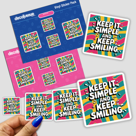 Hand holding a Keep it simple and keep smiling sticker pack, featuring colorful designs with white text, showcasing the unique vinyl art style of Decal Venue.