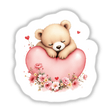 Sleepy Baby Bear with Valentine’s Heart: A charming teddy bear cuddling a heart, available as vibrant stickers or digital art, perfect for adding sweetness to surfaces or digital spaces.