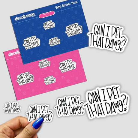 Hand with blue nail polish holds a Can I Pet That Dawg?! sticker, featuring blue and pink design with white text, reflecting Decal Venue's unique vinyl sticker collection.