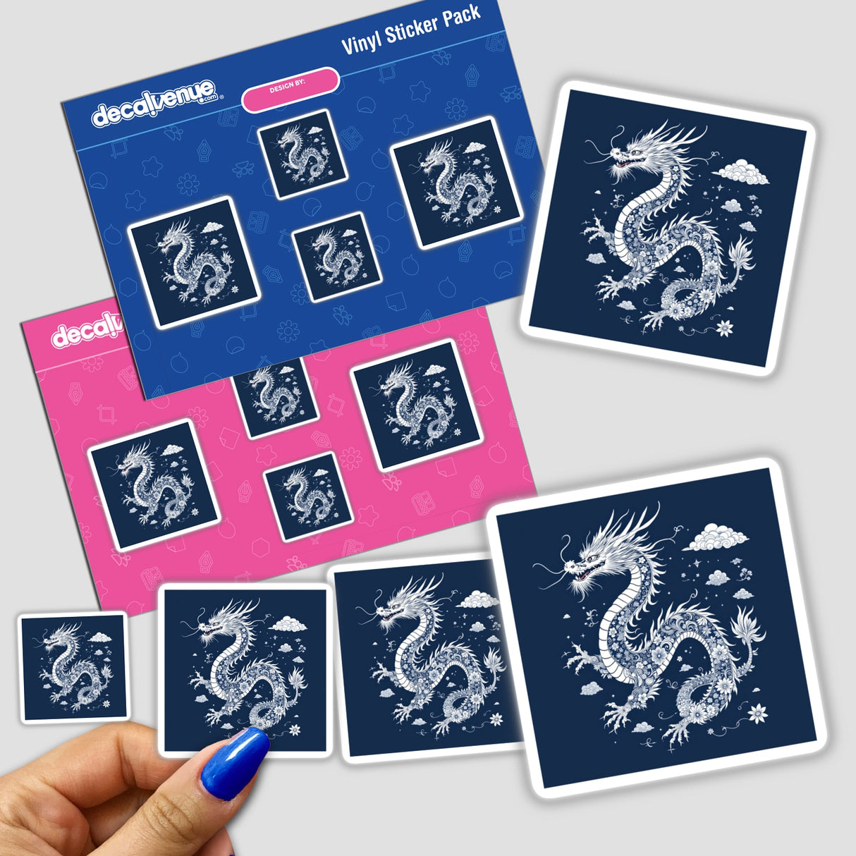 Chinoiserie Dragon sticker pack, featuring intricate white dragon designs on blue backgrounds, held in hand. Available as stickers or digital artwork from Decal Venue, renowned for unique stickers and digital art.