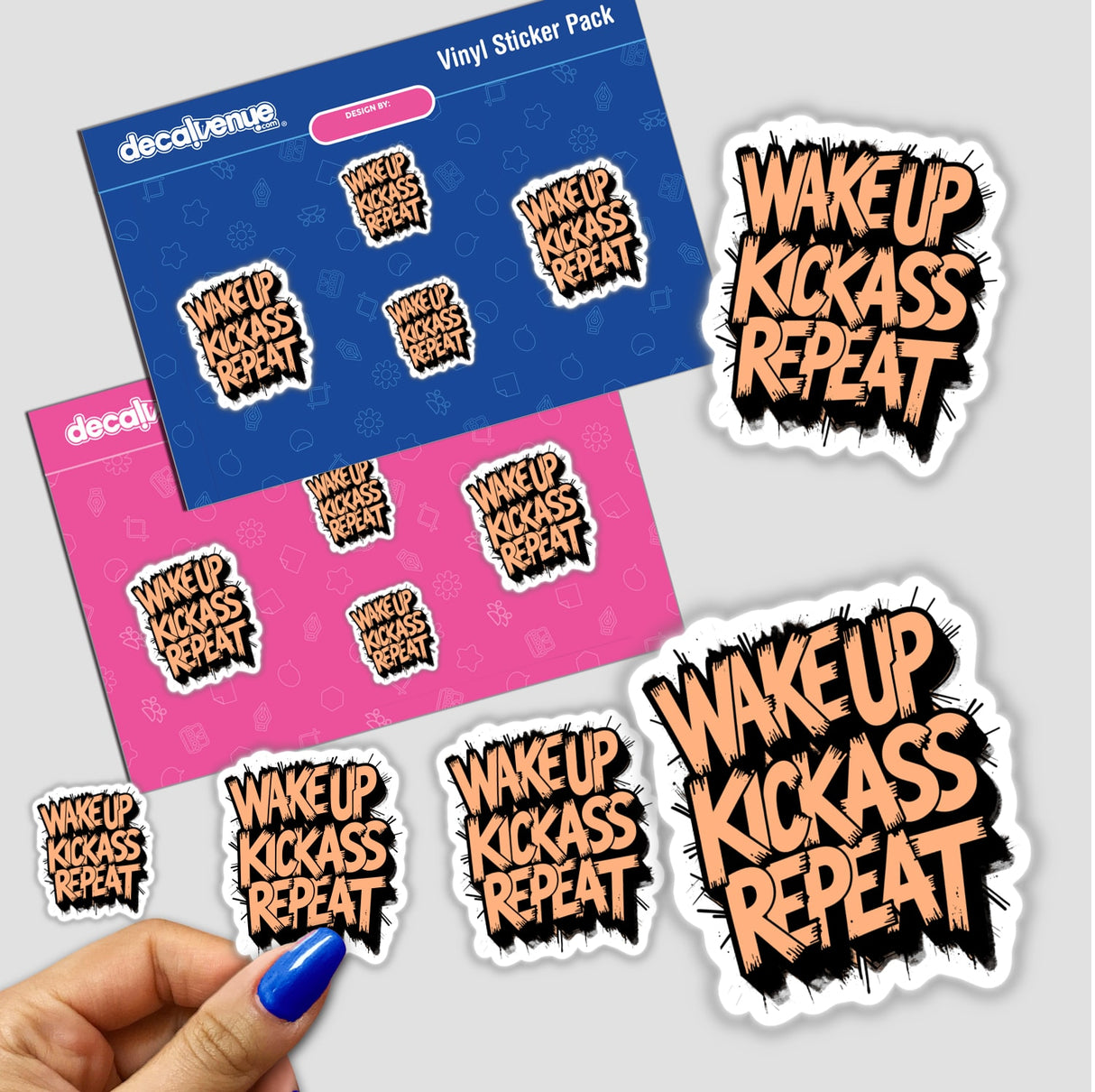 Wake Up Kick Ass Repeat Funny Quote sticker set, featuring unique vinyl designs, with a close-up of a hand holding stickers, reflecting Decal Venue's distinct style in vinyl and digital art.