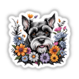 Adorable Schnauzer dog surrounded by vibrant floral arrangement featuring colorful daisies, chrysanthemums, and other blooming flowers.