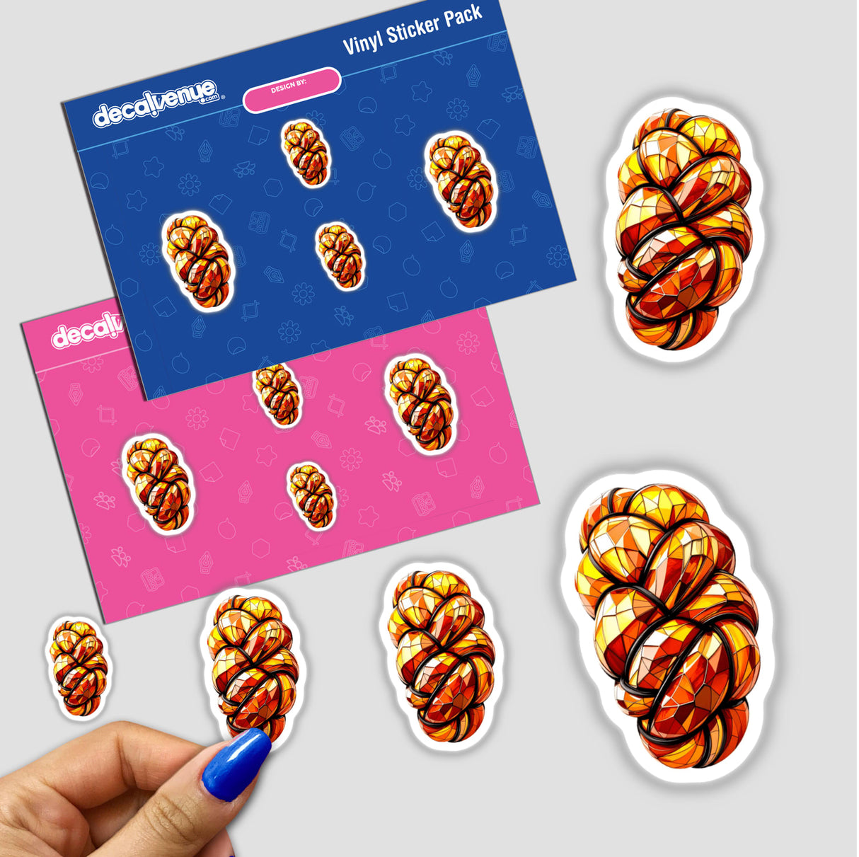 Hand holding a sticker pack featuring Challah Bread Stained Glass Style design, showcasing intricate patterns available as stickers or digital artwork from Decal Venue.