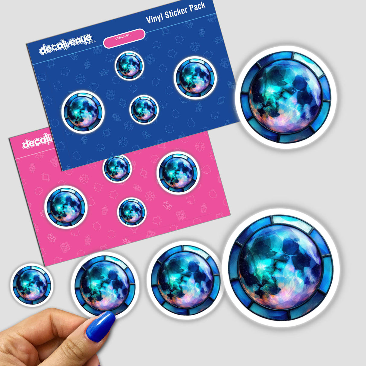 Moon Stained Glass Style sticker featuring a close-up of a blue-painted finger with intricate circular designs, available as a sticker or digital artwork from Decal Venue.